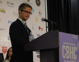 Jake Thornton speaks during the Community Behavioral Health Conference earlier this month. Thornton spoke about his experiences growing up with autism during a panel called, 